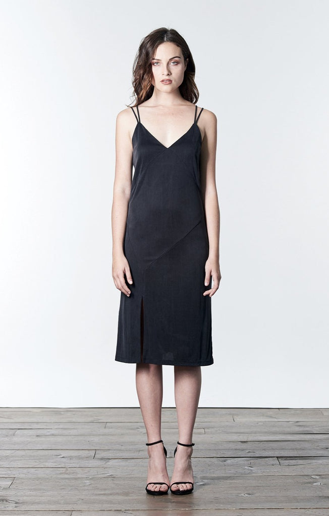 Soft black, midi-length, slip dress with slit.