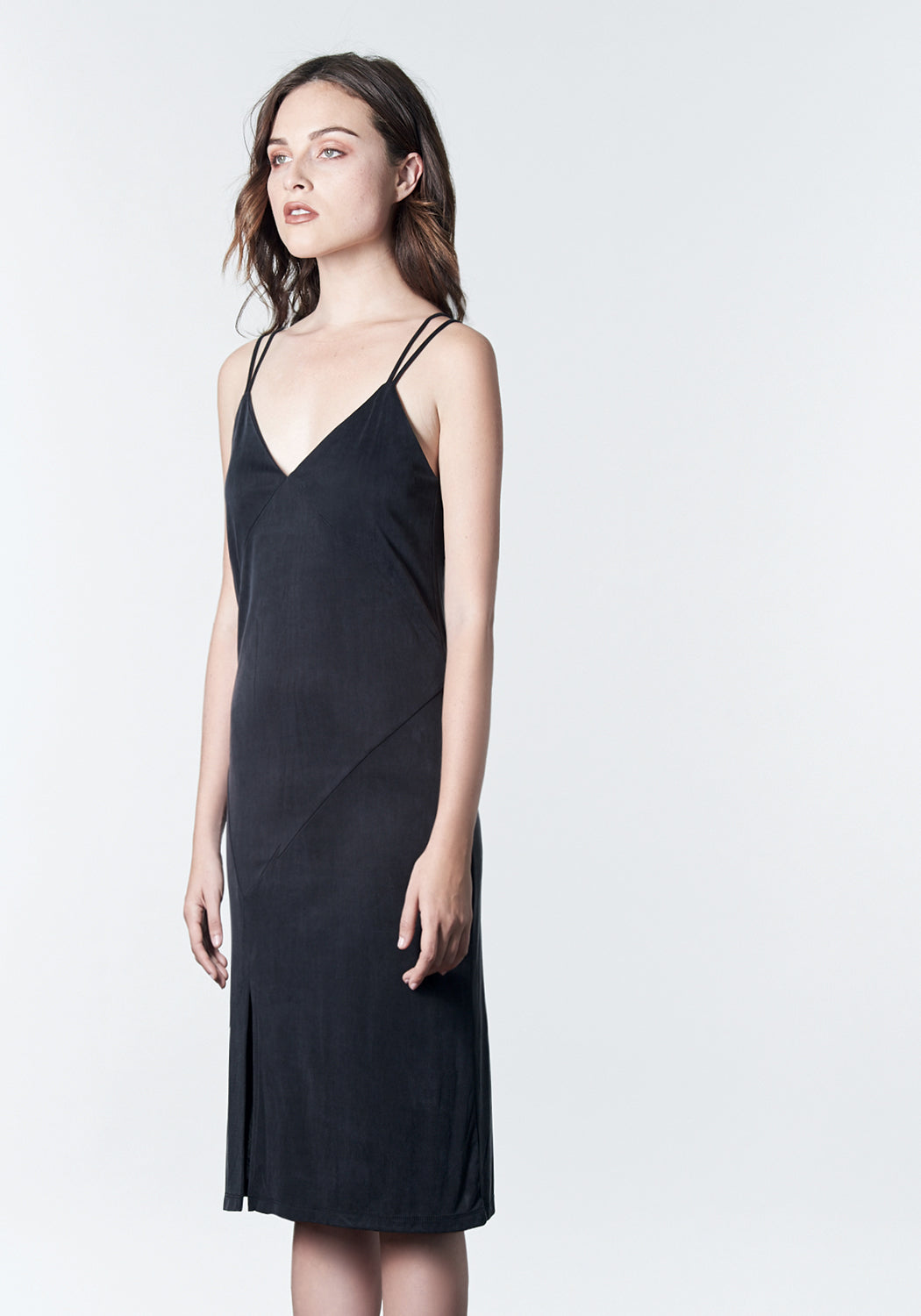 Soft black, midi-length, slip dress with slit.