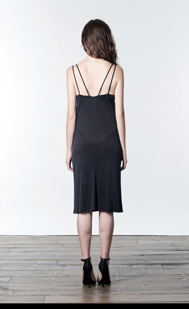 Soft black, midi-length, slip dress with slit.