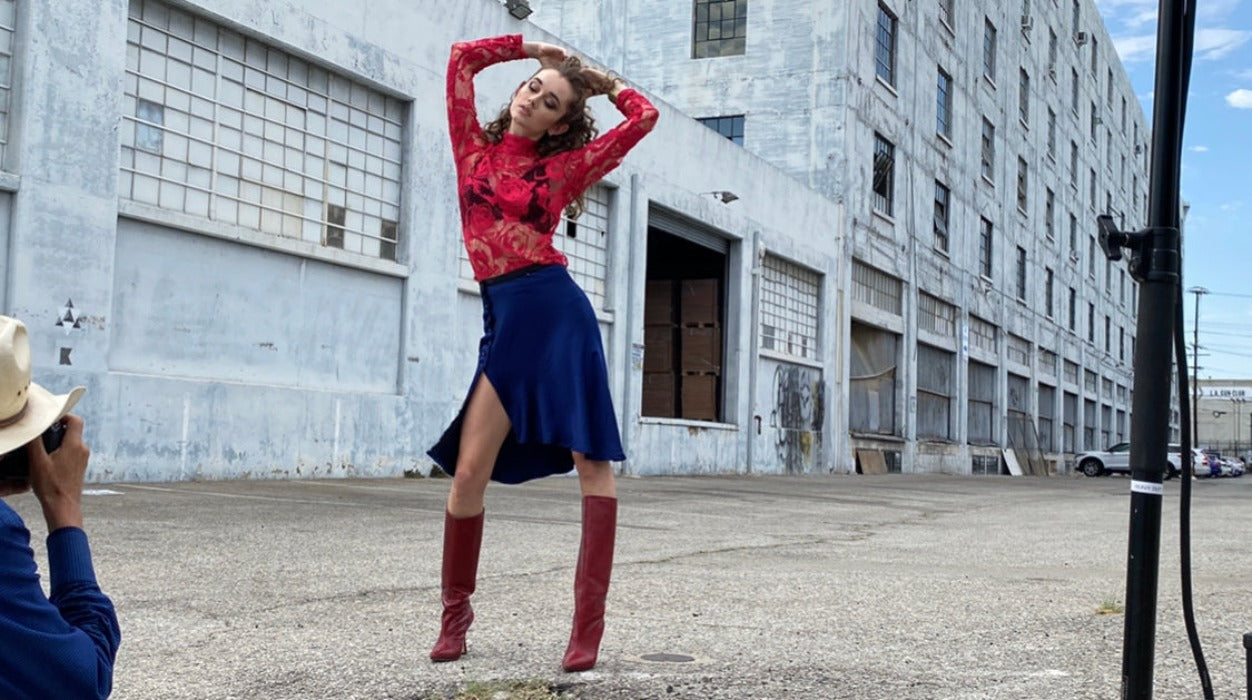 woman's hot pink lace and embroidered top with cobalt blue skirt