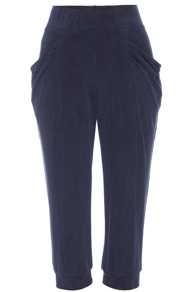 Navy silky knit relaxed fit pant in 3/4 length with loose pockets.