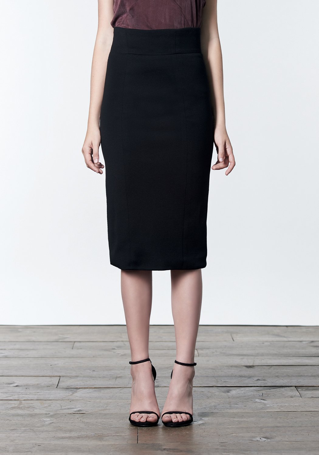 Black wool tencel pencil skirt with back zipper details.
