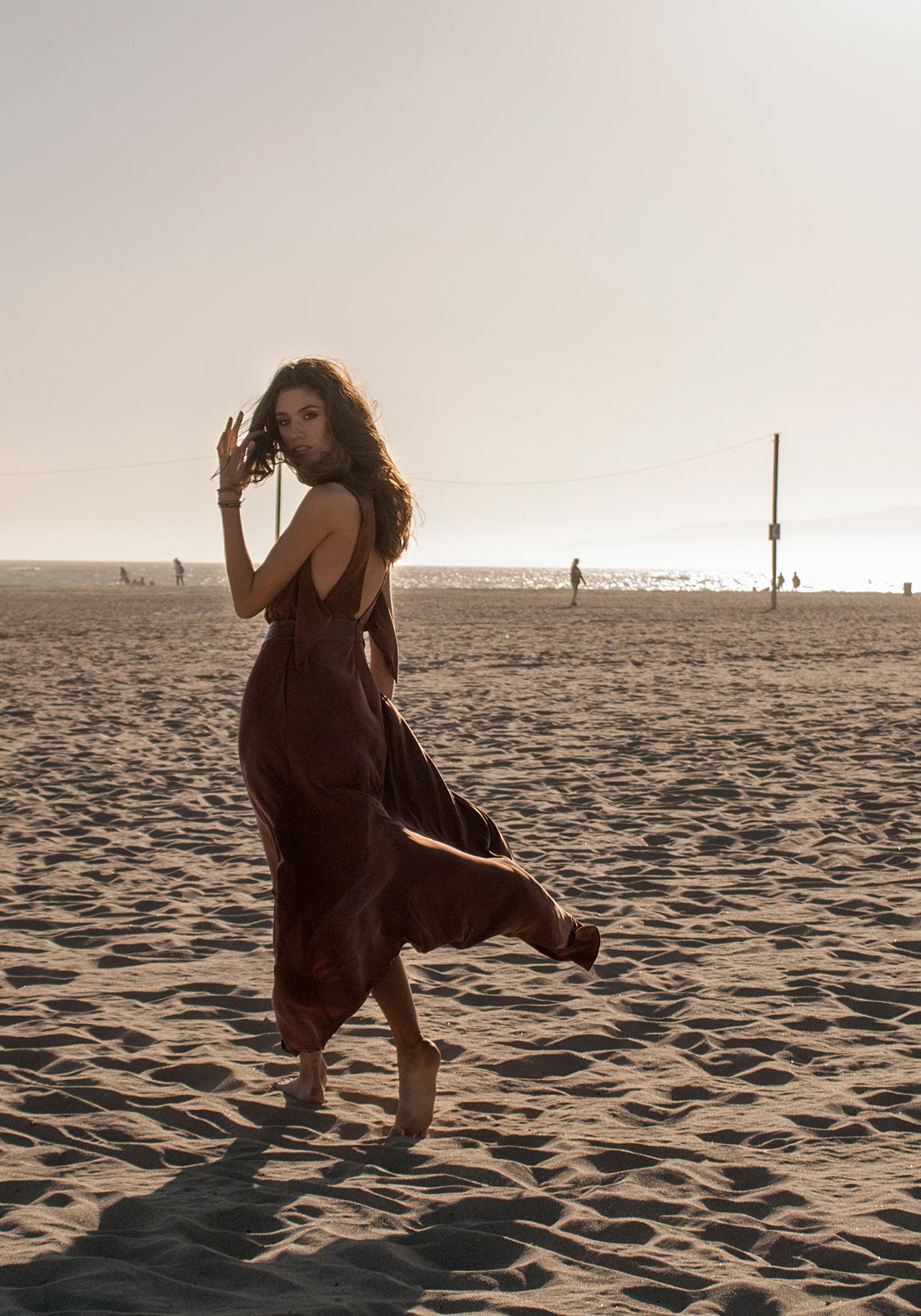 Long, winter maxi dress in brown, cognac color that can be dressed up and worn as a gown to black tie or other evening event or dressed down for daytime looks.