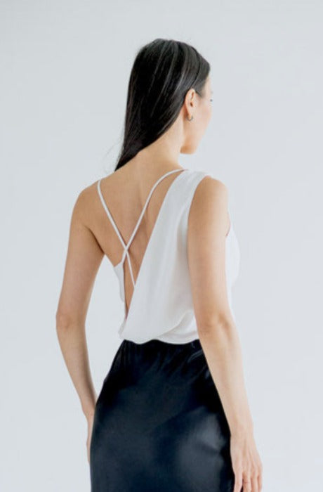 Women's white backless silk blouse.