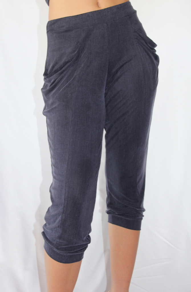 Navy silky knit relaxed fit pant in 3/4 length with loose pockets.