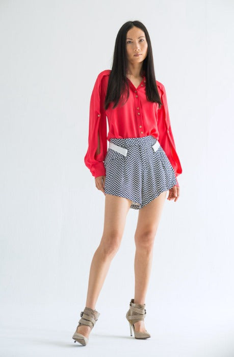 Silk chevron shorts and cut-out blouse.