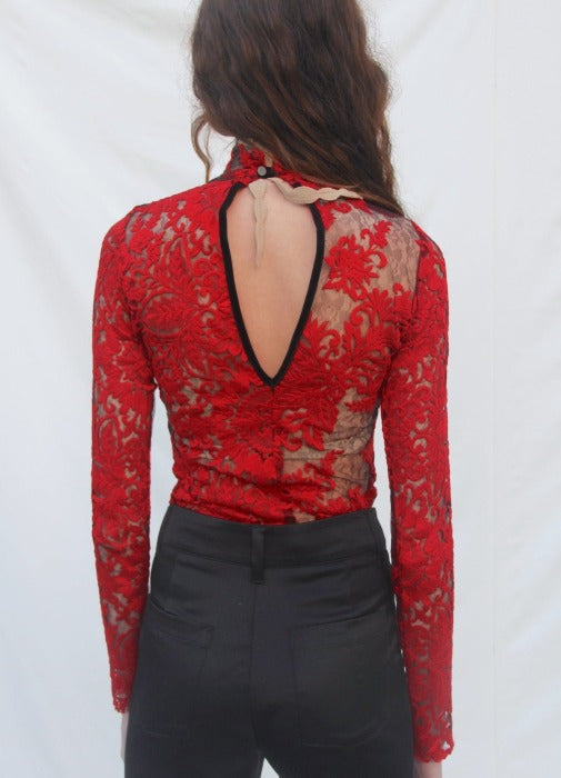 Woman's red embroidered and lace top