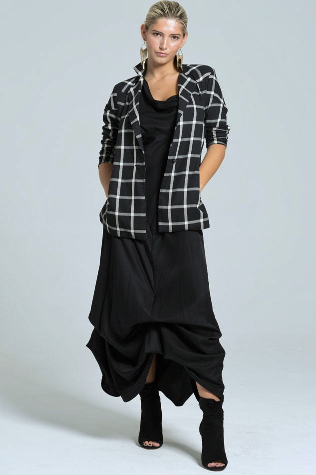 woman's plaid blazer and black dress