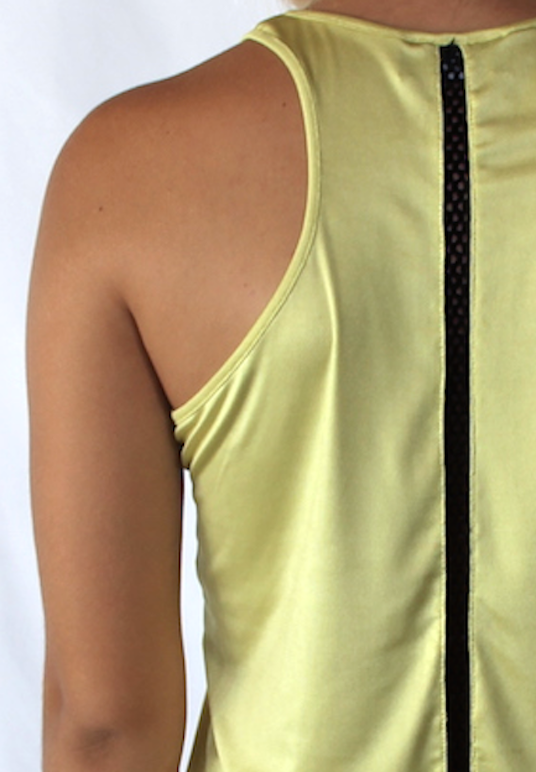 Back view of yellow racer back tank with black honeycomb stripe down the back.