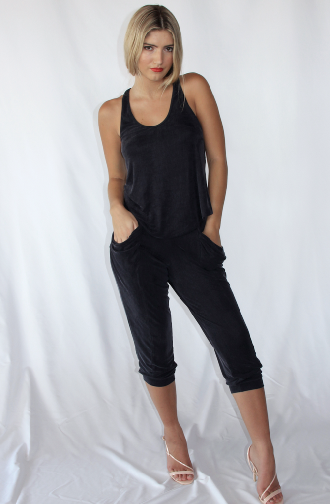 Navy silky knit relaxed fit pant in 3/4 length with loose pockets.
