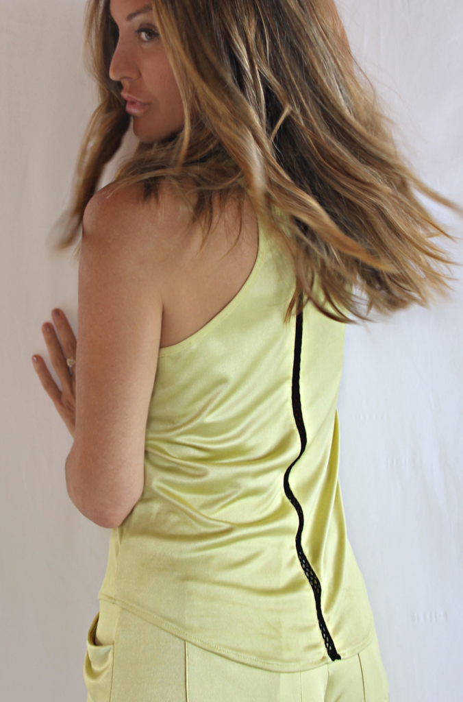 yellow racer back tank top with black honeycomb knit stripe in back.