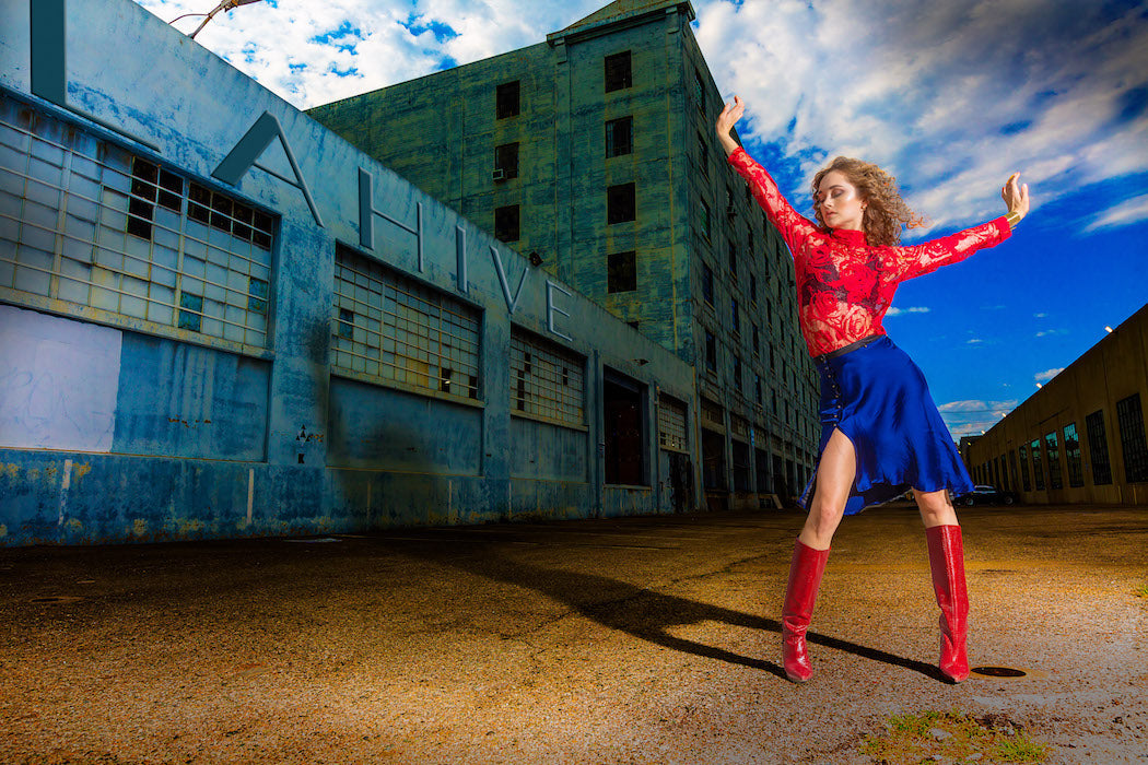 Woman's red lace top and cobalt blue skirt