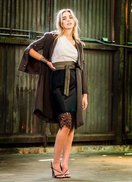 Black slinky slip skirt with bias draped white tank and knit jacket.